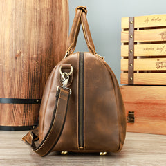 Coffee leather travel duffel, side profile with shoulder strap