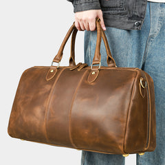 Coffee leather travel duffel, handheld front three-quarter view