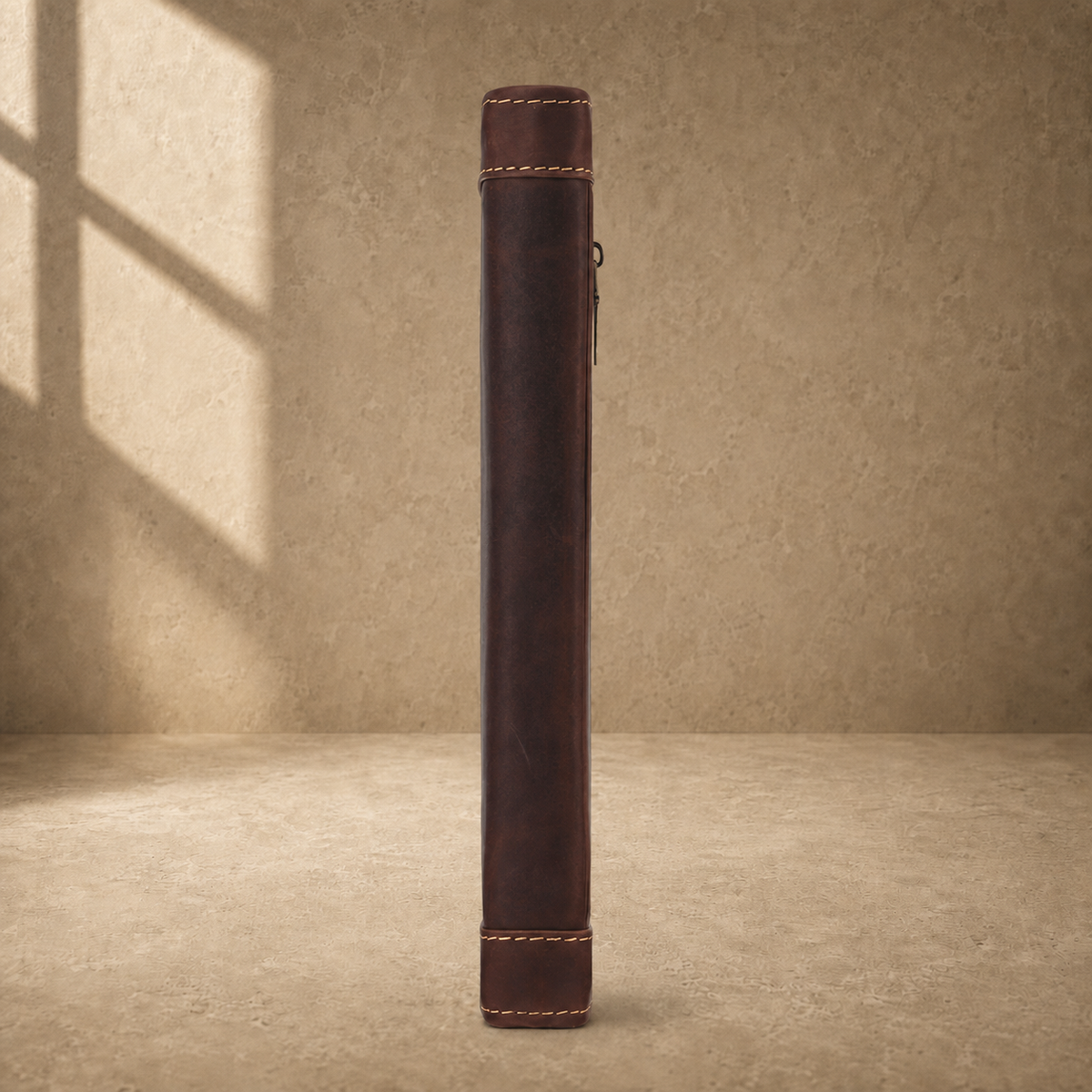 Dark brown leather travel work portfolio spine side view