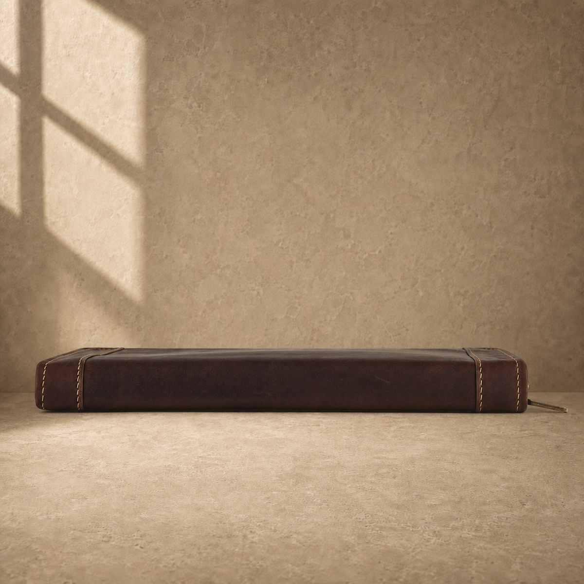 Dark brown leather travel work portfolio base edge view
