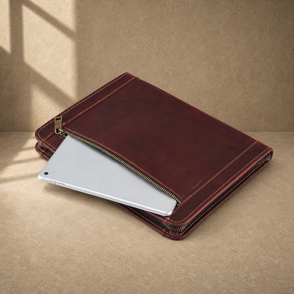 Oxblood leather zip travel portfolio exterior tablet pocket view