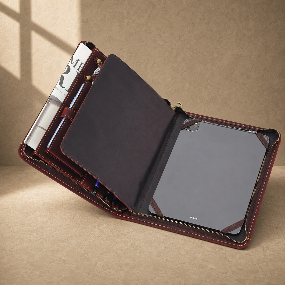 Oxblood leather zip travel portfolio angled tablet interior view