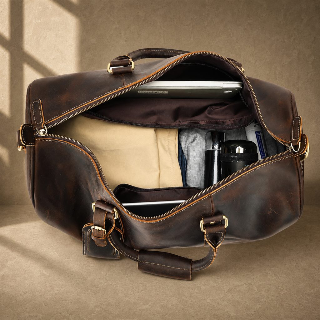 Deep coffee cowhide weekender duffle, packed main compartment view