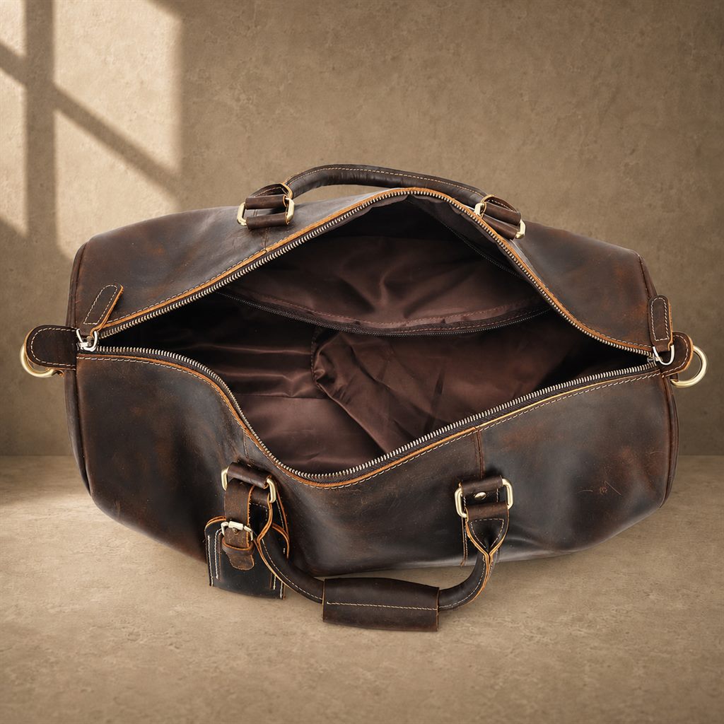 Deep coffee cowhide weekender duffle, empty main compartment view