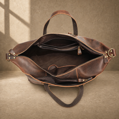 Brown cowhide weekender bag open empty interior view