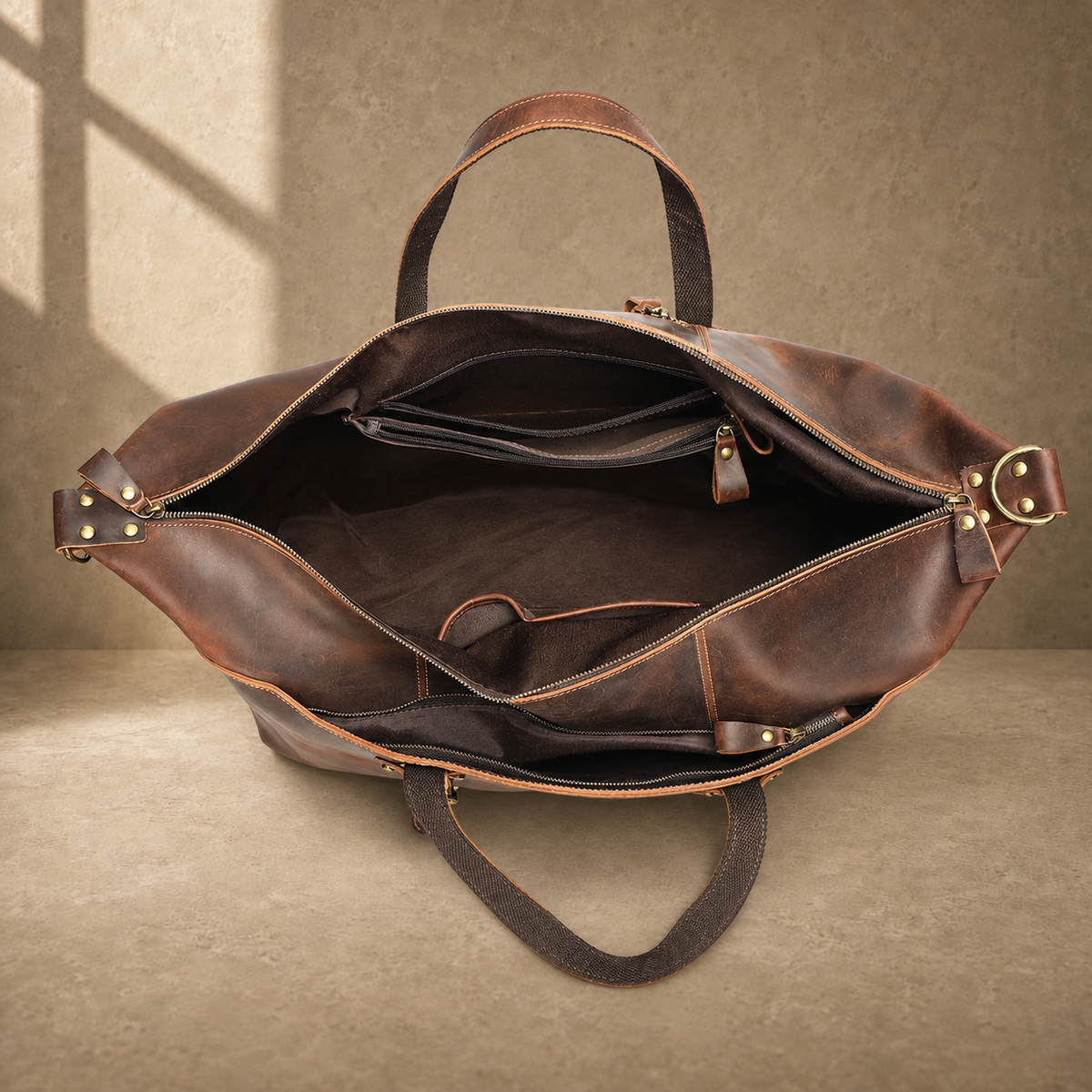 Brown cowhide weekender bag open empty interior view