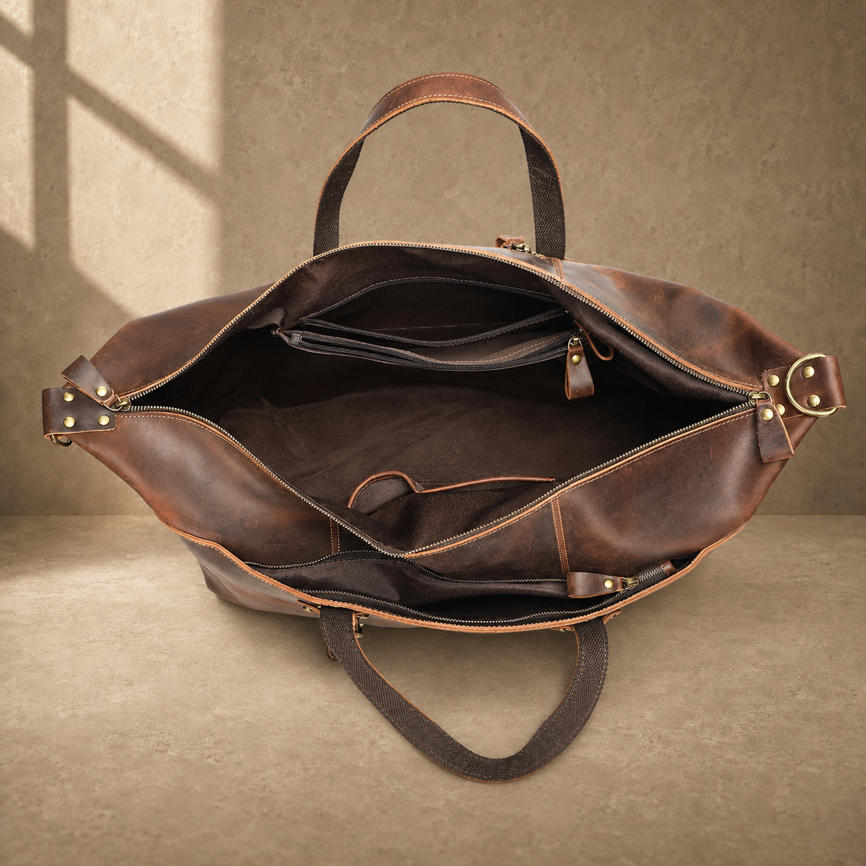 Brown cowhide weekender bag open empty interior view