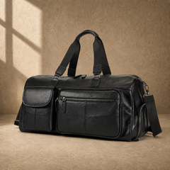 Black cowhide travel duffel, three-quarter front view