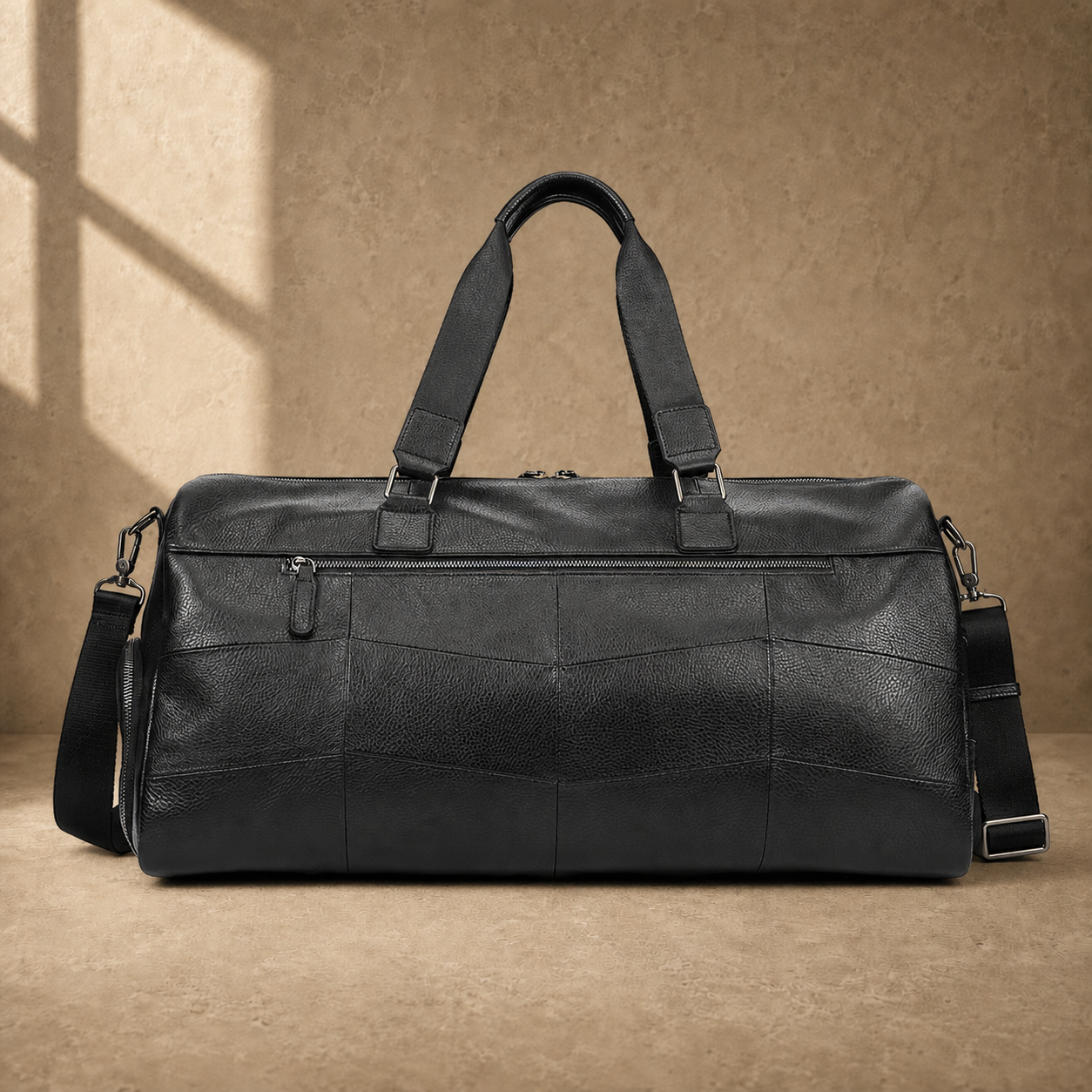 Black cowhide travel duffel, rear zipper pocket view