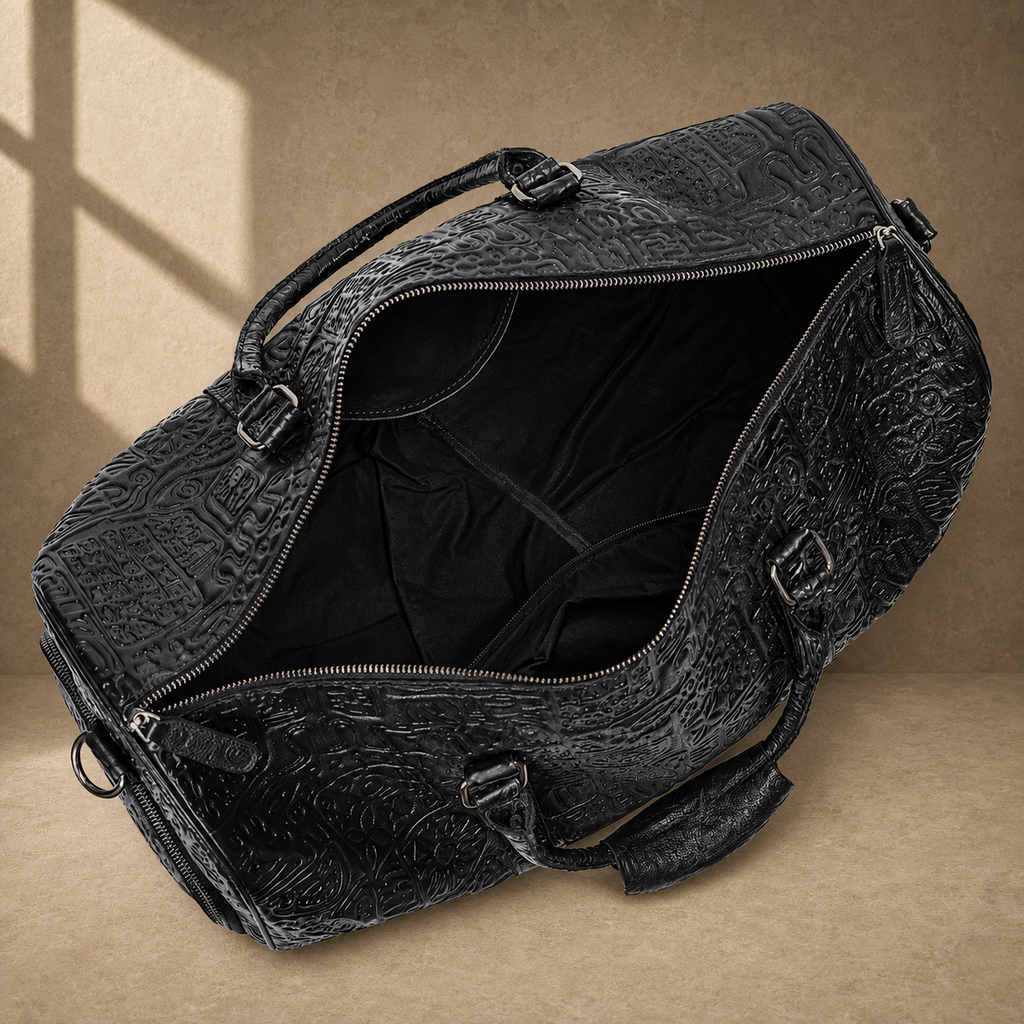 Black embossed leather travel duffel, open empty interior view