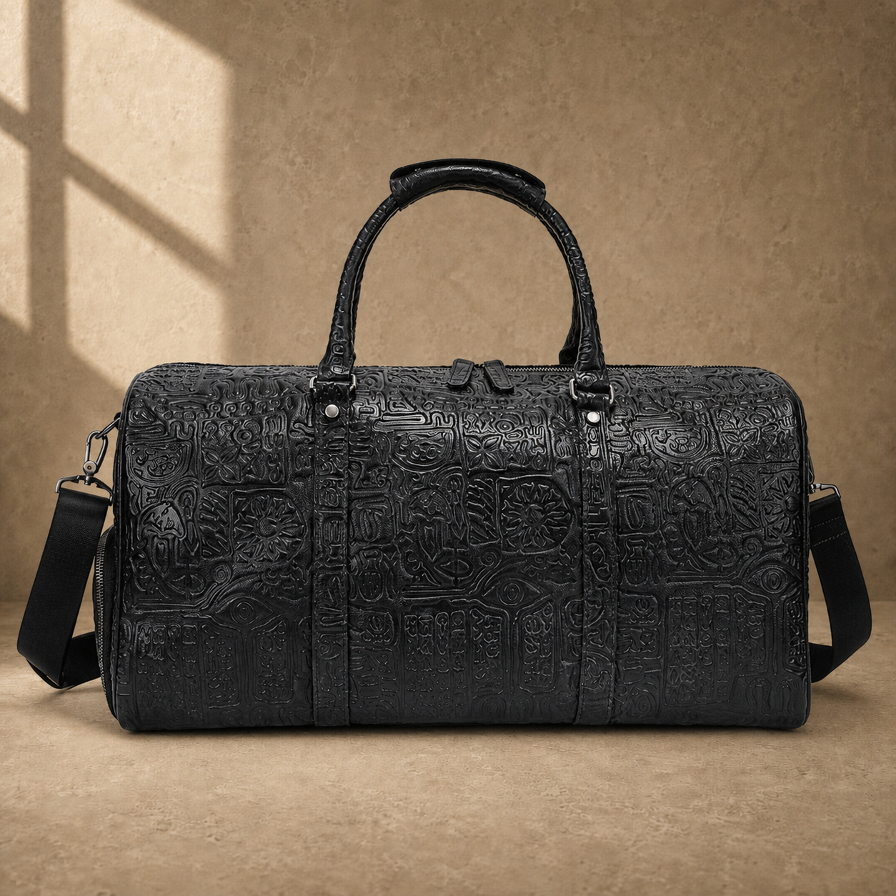 Black embossed leather travel duffel, straight front hero view