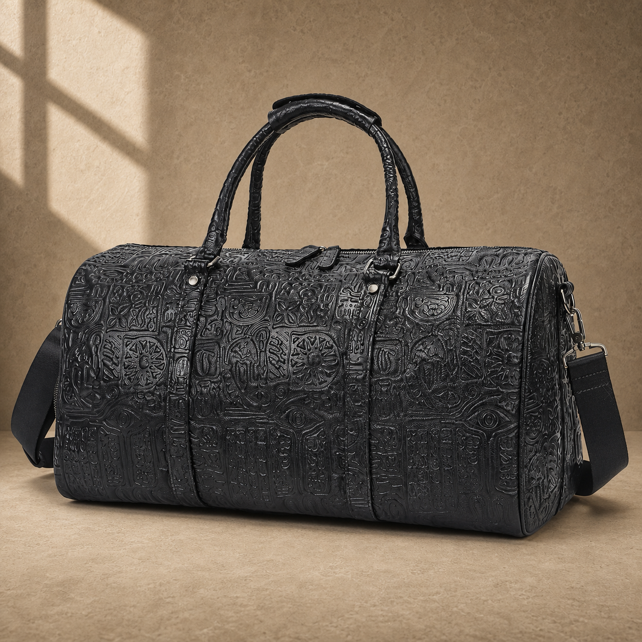 Black embossed leather travel duffel, three-quarter front view