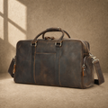 Deep coffee leather weekender duffel, front three-quarter hero view