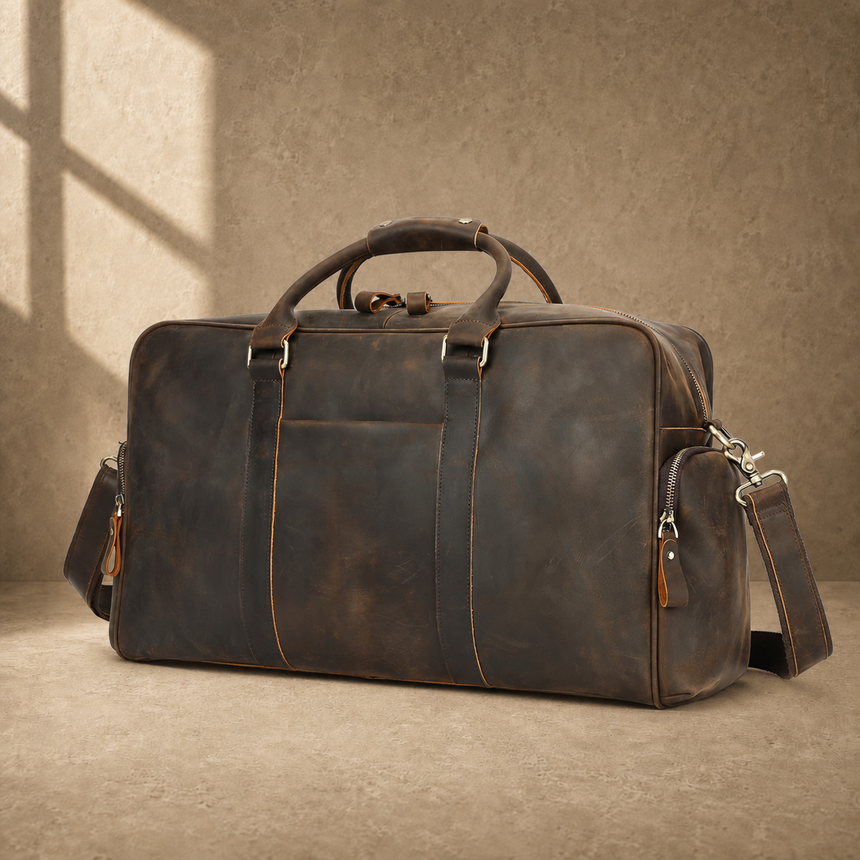 Deep coffee leather weekender duffel, front three-quarter hero view