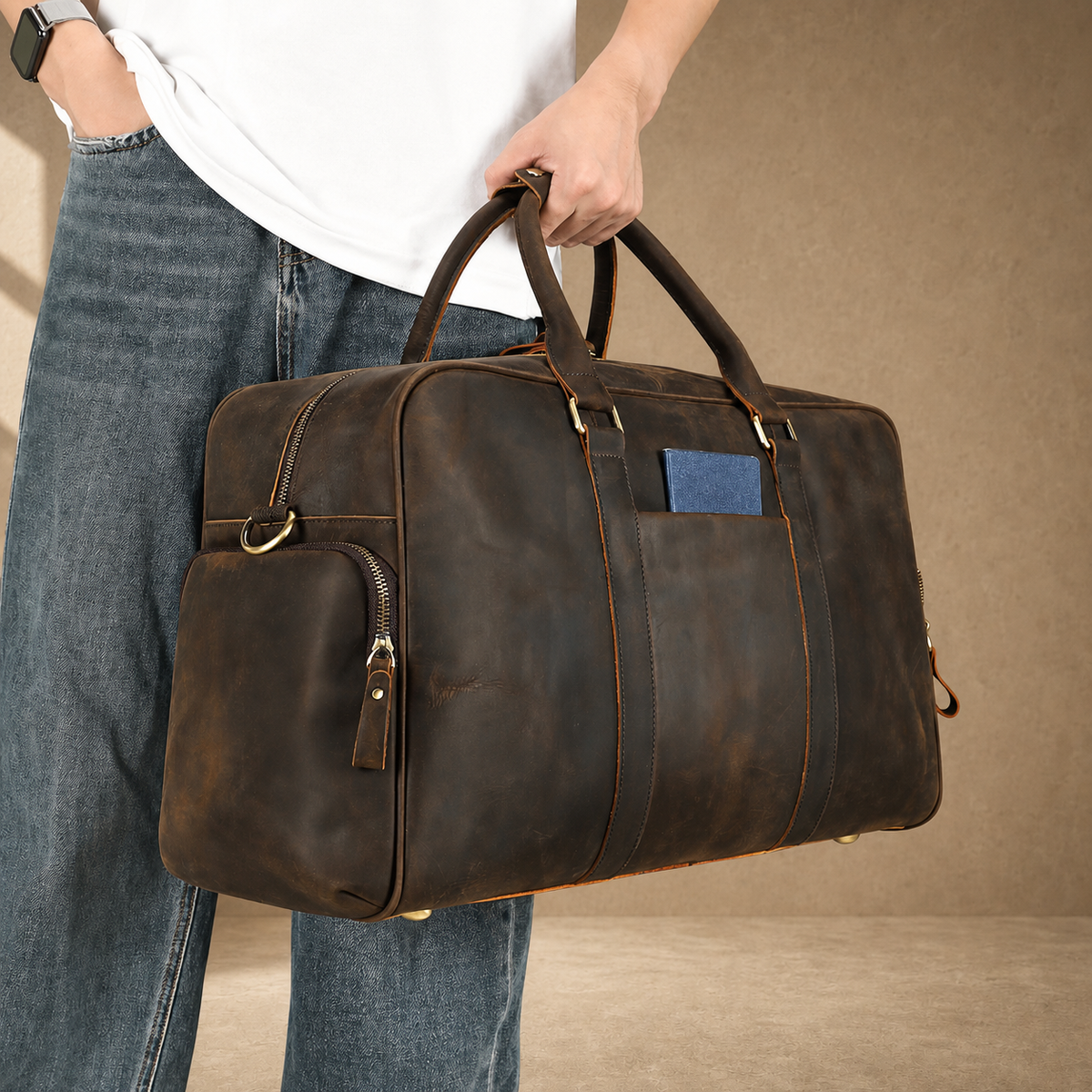 Deep coffee leather weekender duffel, hand-carry lifestyle view