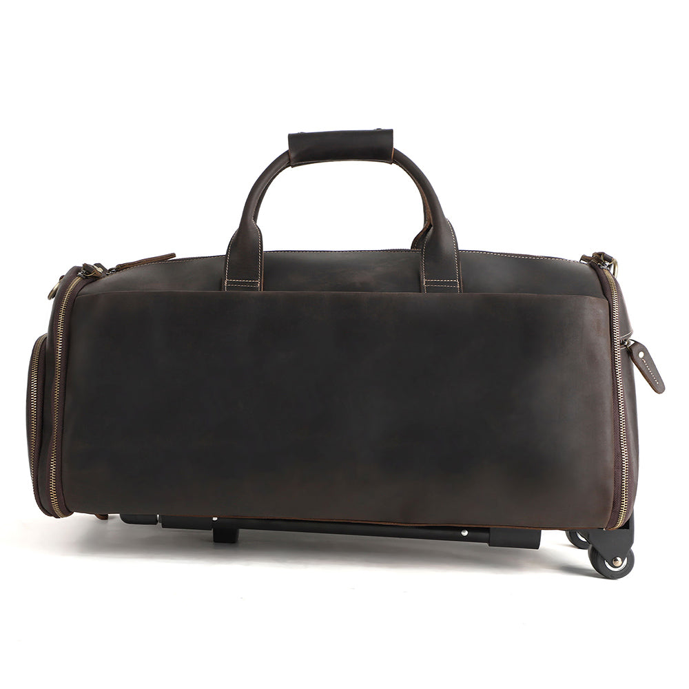 Fold-out garment section displayed beside the closed leather travel bag