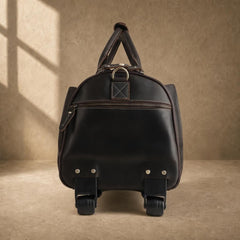 Side view of brown rolling garment bag with wheels and zip pocket