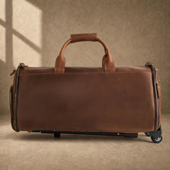 Cognac cowhide rolling garment travel bag shown from the front