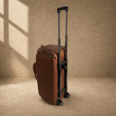 Cognac rolling garment travel bag standing with trolley handle extended