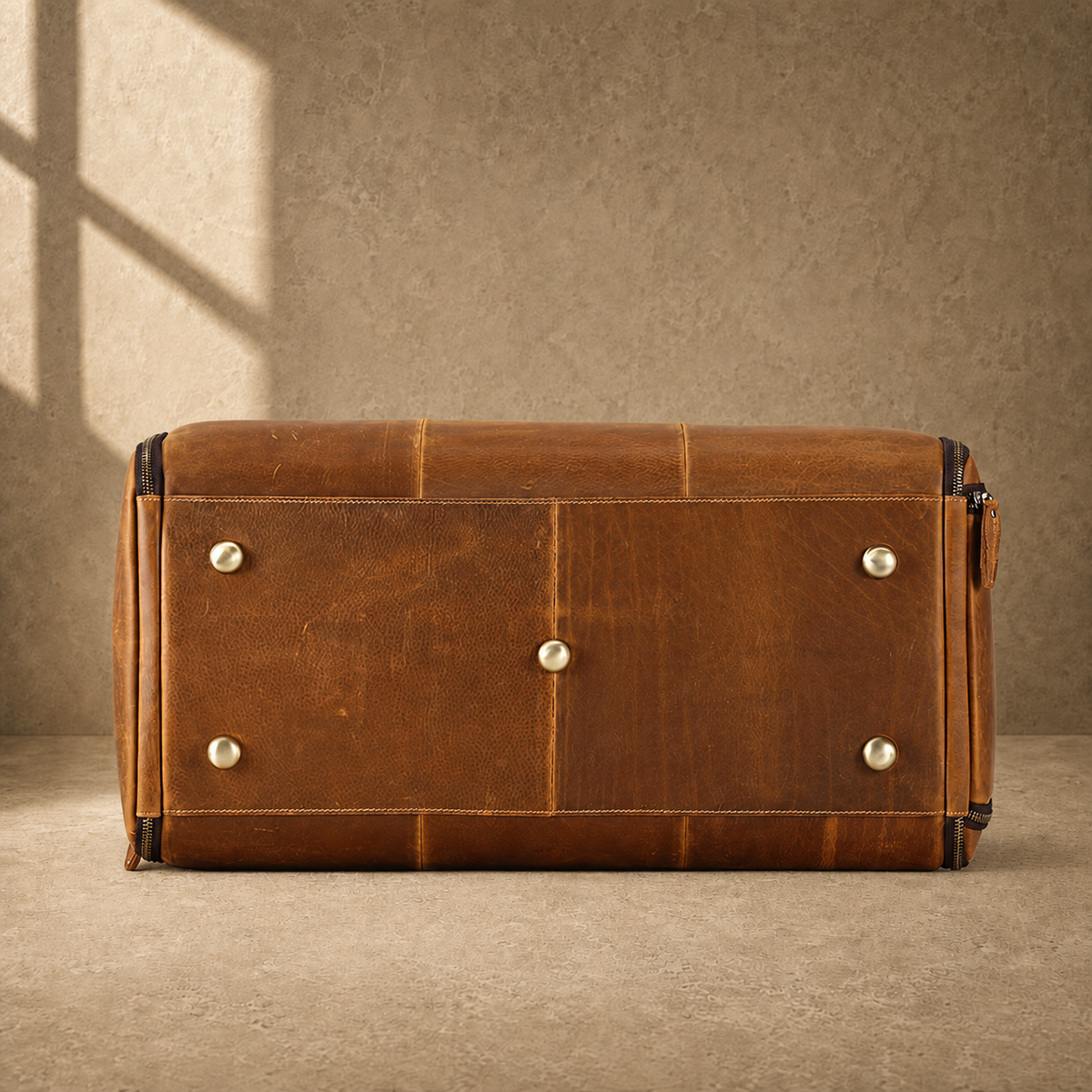 Cognac leather garment weekender bag, base view
