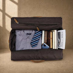 Cognac garment weekender packed with shirt, books and travel essentials