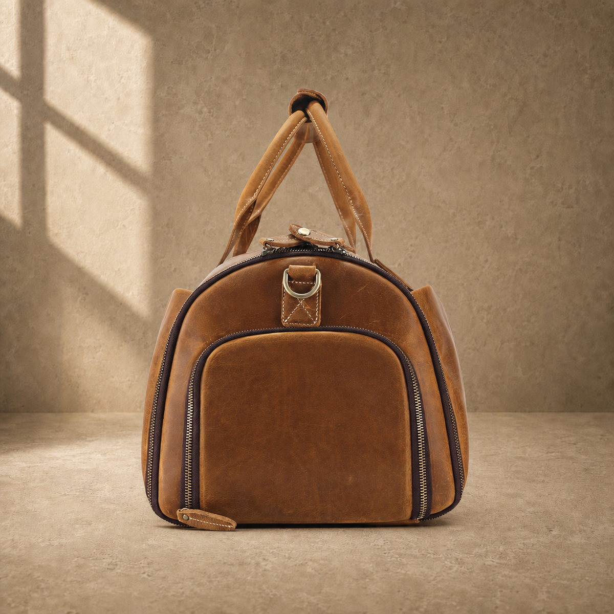 Cognac leather garment weekender showing zippered shoe compartment