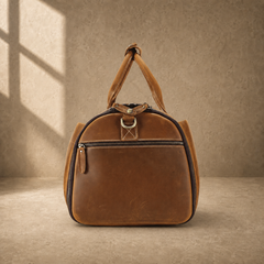 Cognac leather garment weekender showing side zip pocket