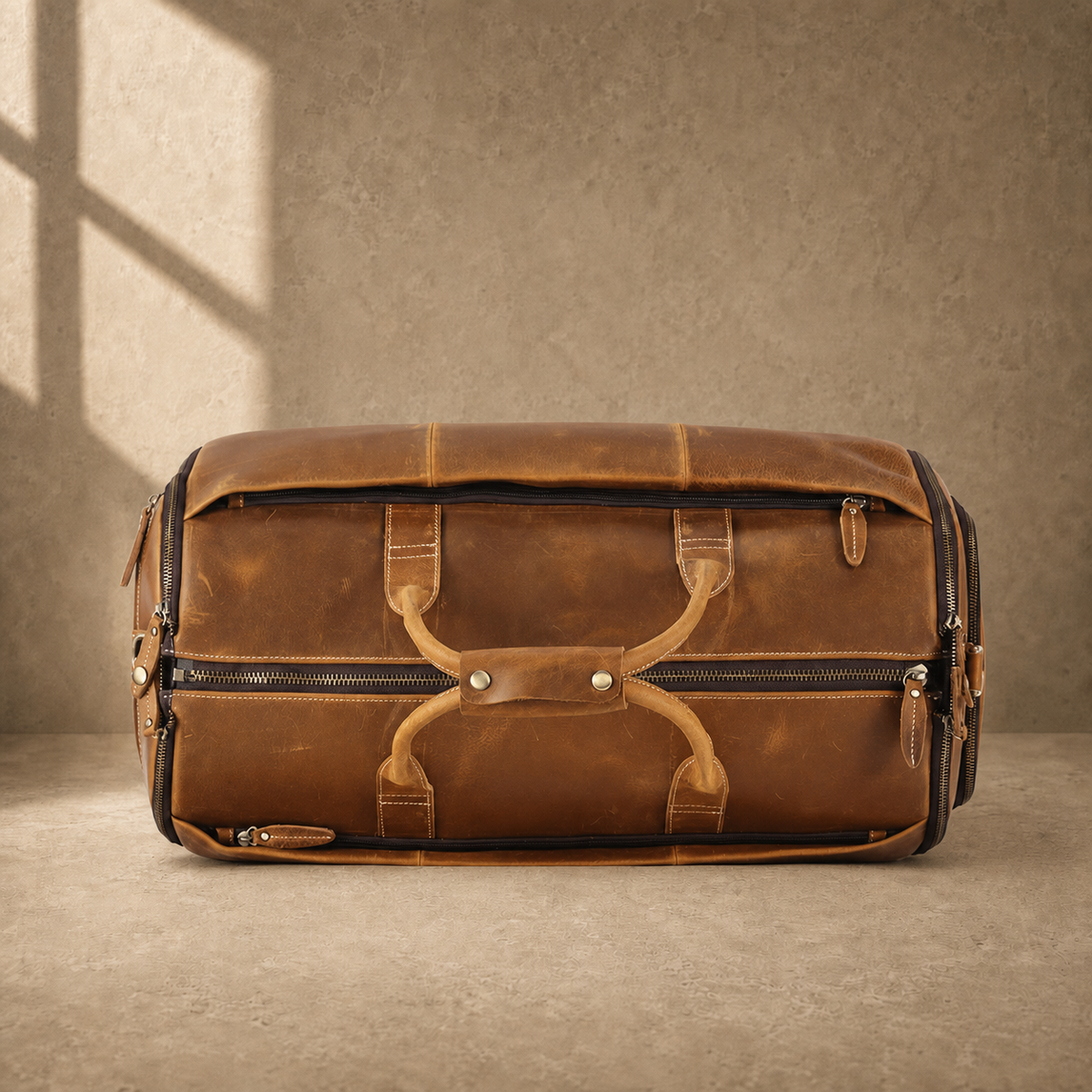 Cognac leather garment weekender bag, top view
