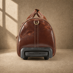 Handle-end view of coffee leather rolling travel duffel