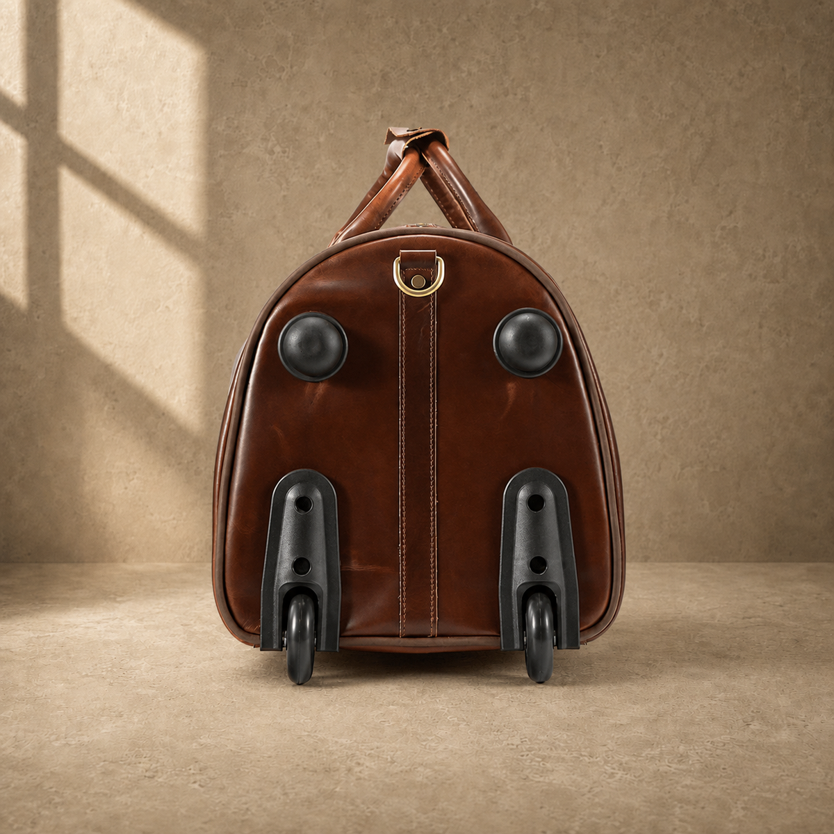 Wheel-end view of coffee leather rolling weekender