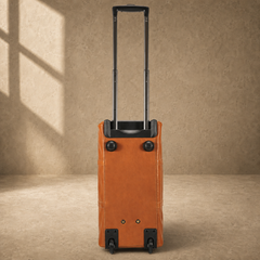 End view of cognac rolling duffel showing four wheels and trolley handle