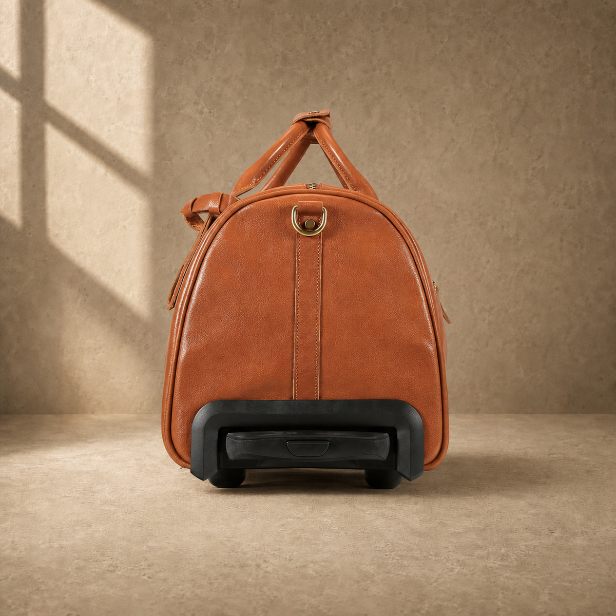 Handle-end view of cognac leather rolling weekender