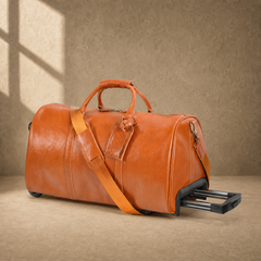 Cognac leather wheeled duffel with telescoping handle partially extended