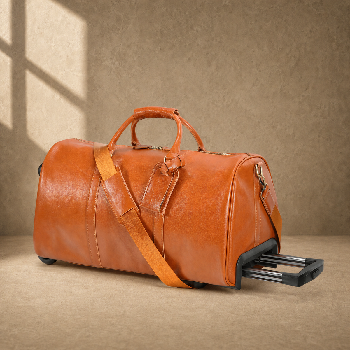 Cognac leather wheeled duffel with telescoping handle partially extended