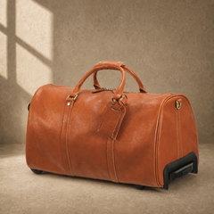 Cognac leather rolling travel duffel, three-quarter view