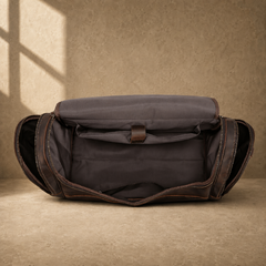Brown leather business travel duffel showing empty main compartment
