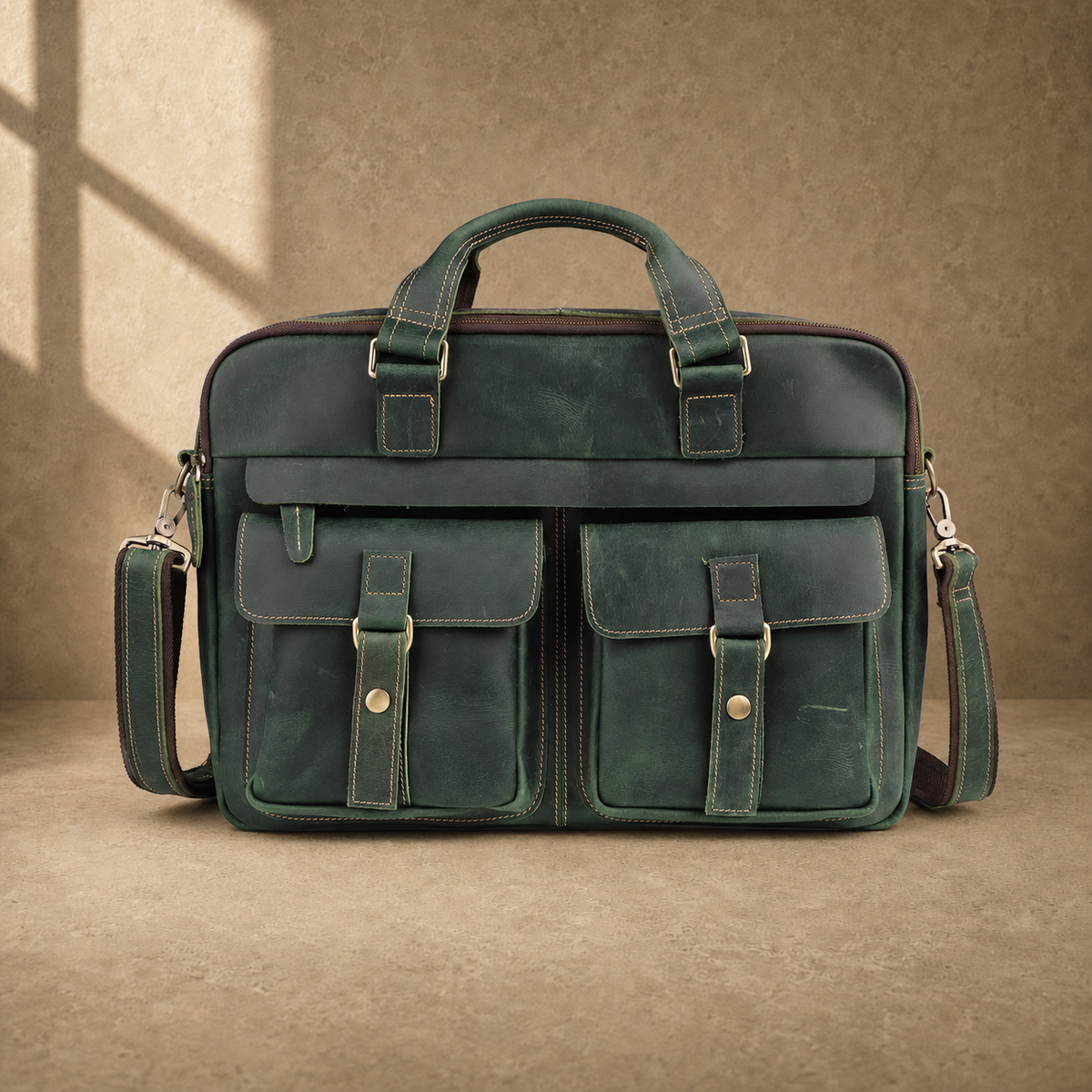 Vintage green leather work briefcase with shoulder strap, front view