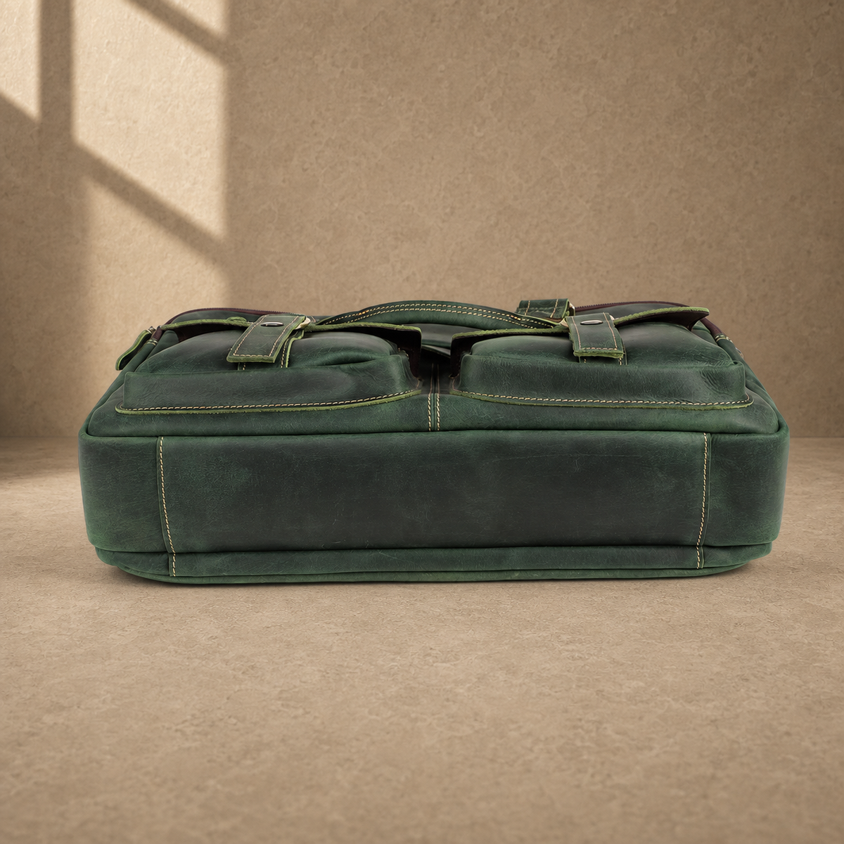Vintage green leather work briefcase, reinforced base view