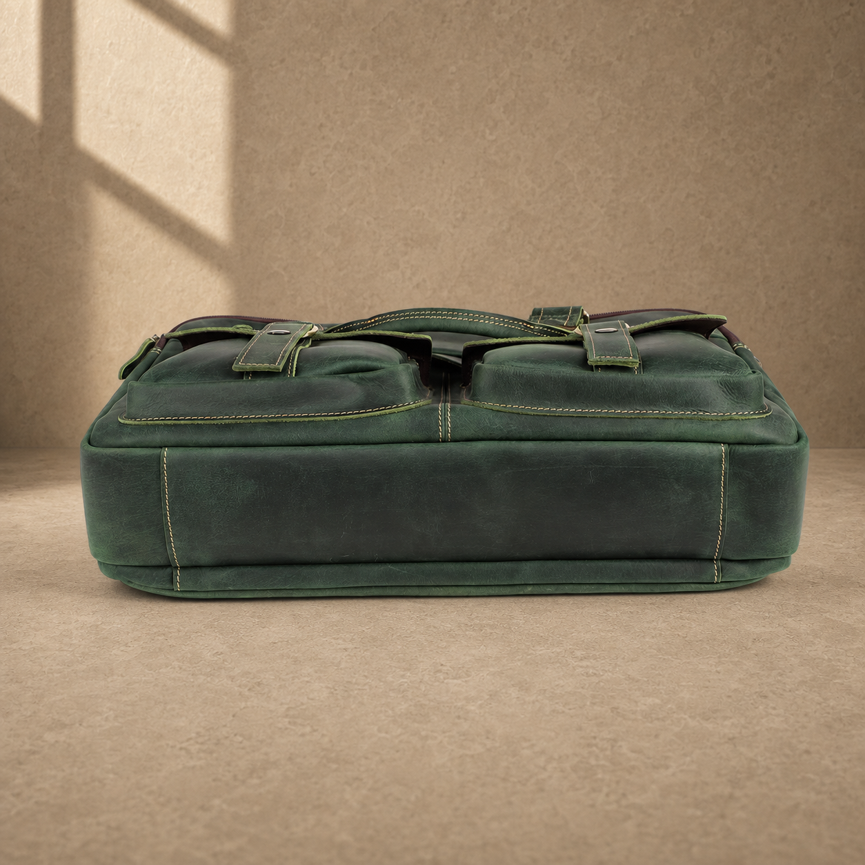 Vintage green leather work briefcase, reinforced base view