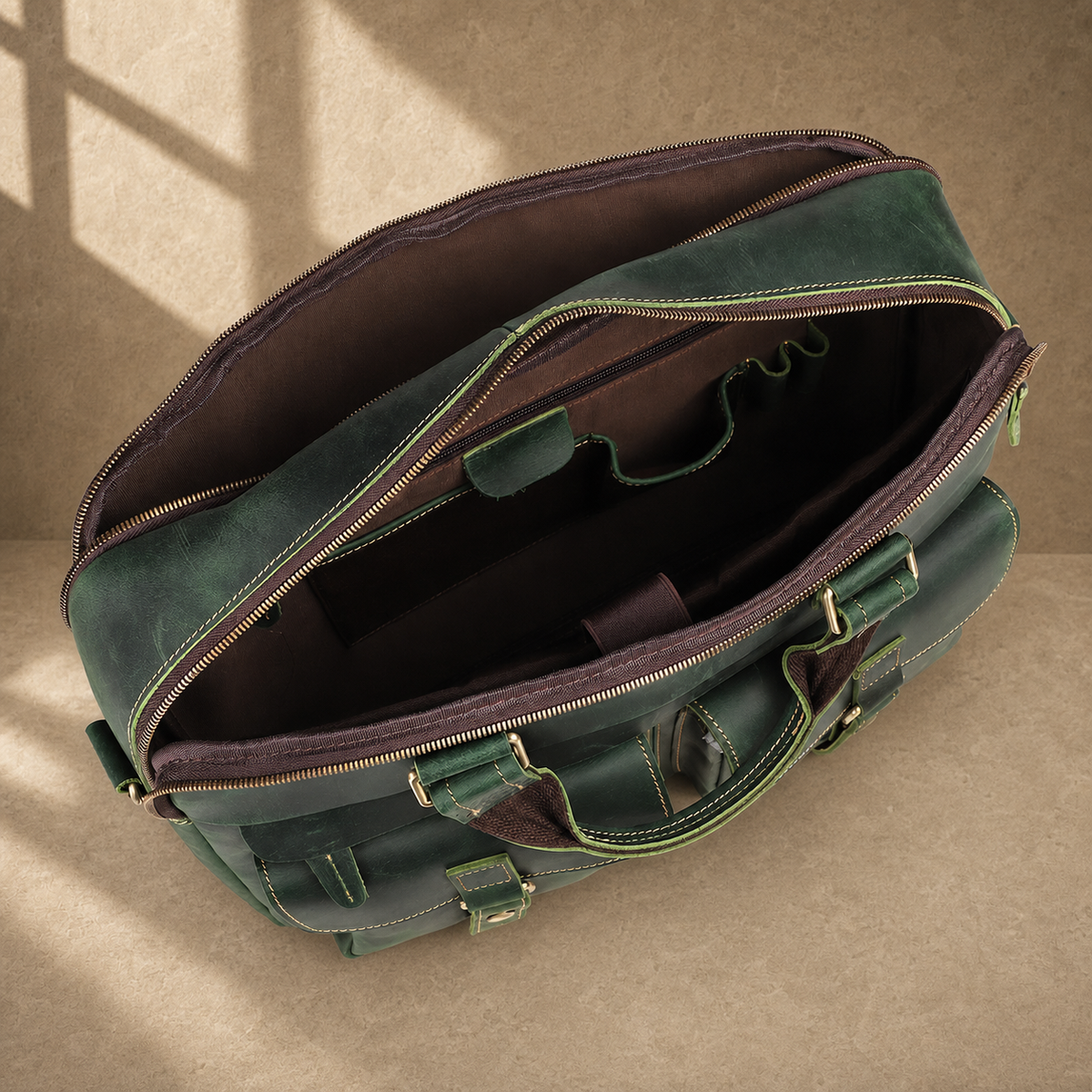 Vintage green leather work briefcase, open empty compartments