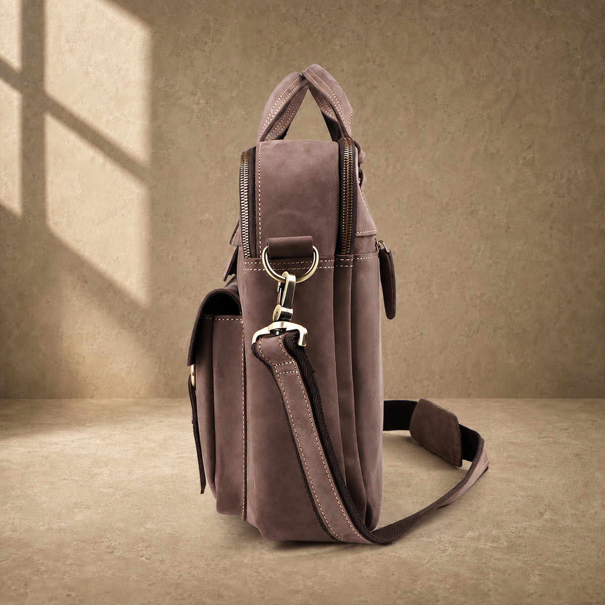 Khaki business briefcase showing side profile and strap hardware