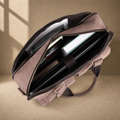 Khaki business briefcase packed with laptop, tablet and notebooks