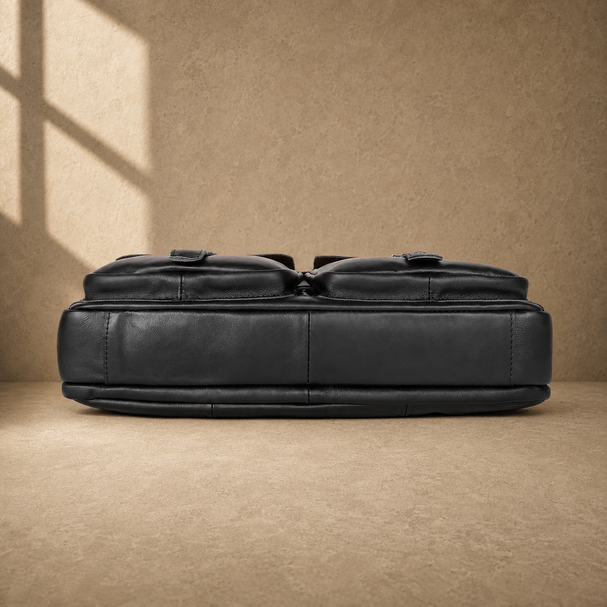 Black leather multi pocket briefcase, reinforced base view