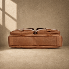 Brown multi-pocket leather briefcase, reinforced base view