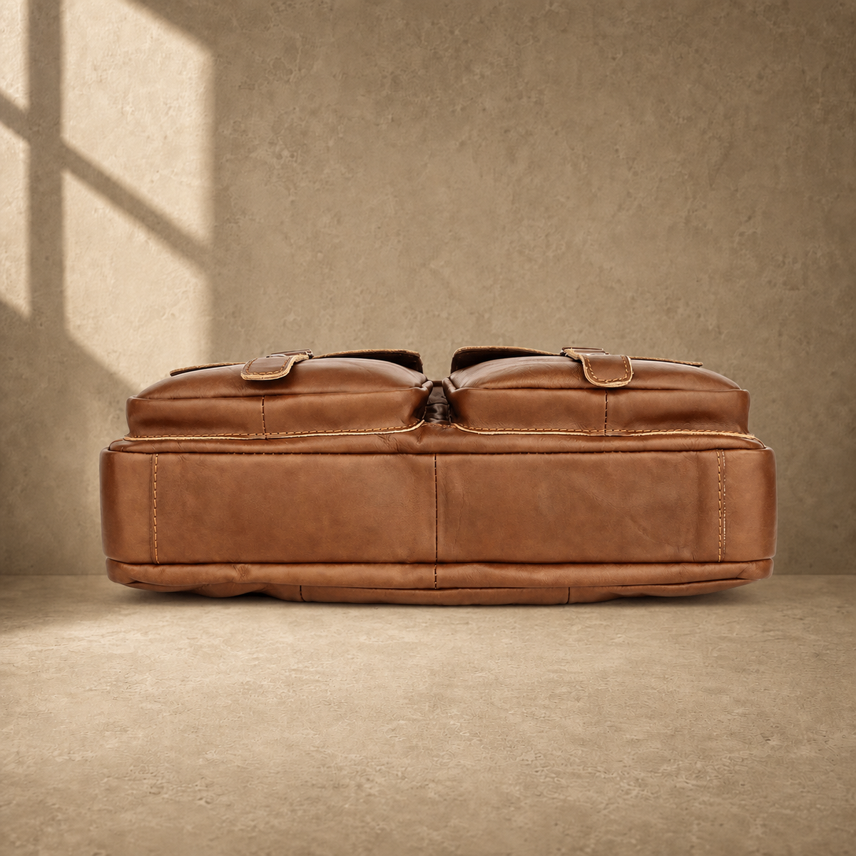Brown multi-pocket leather briefcase, reinforced base view