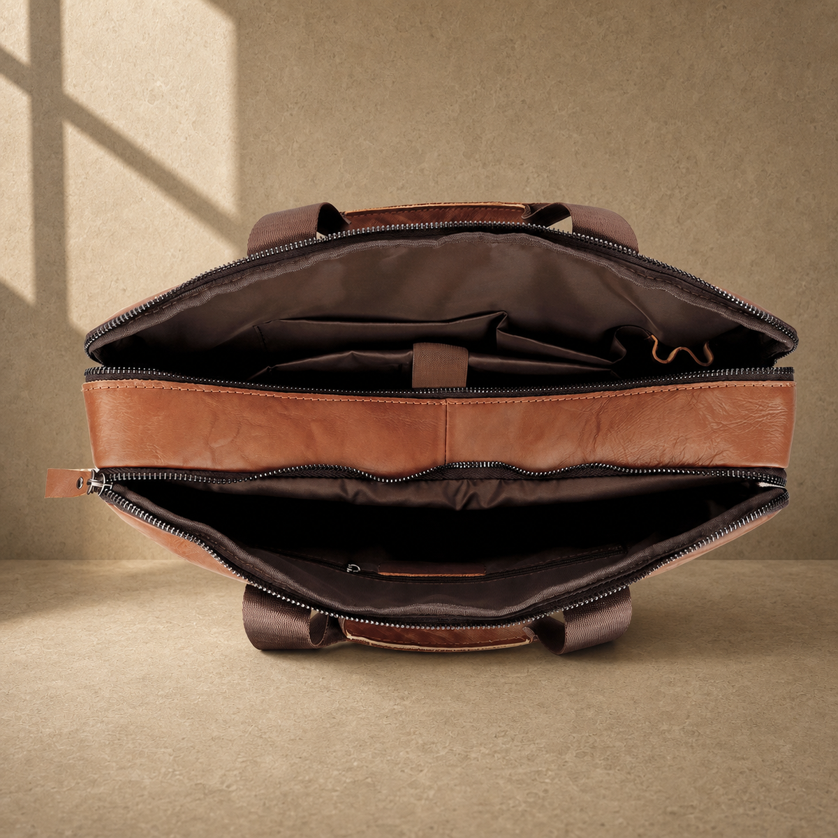 Brown multi-pocket leather briefcase showing empty dual compartments