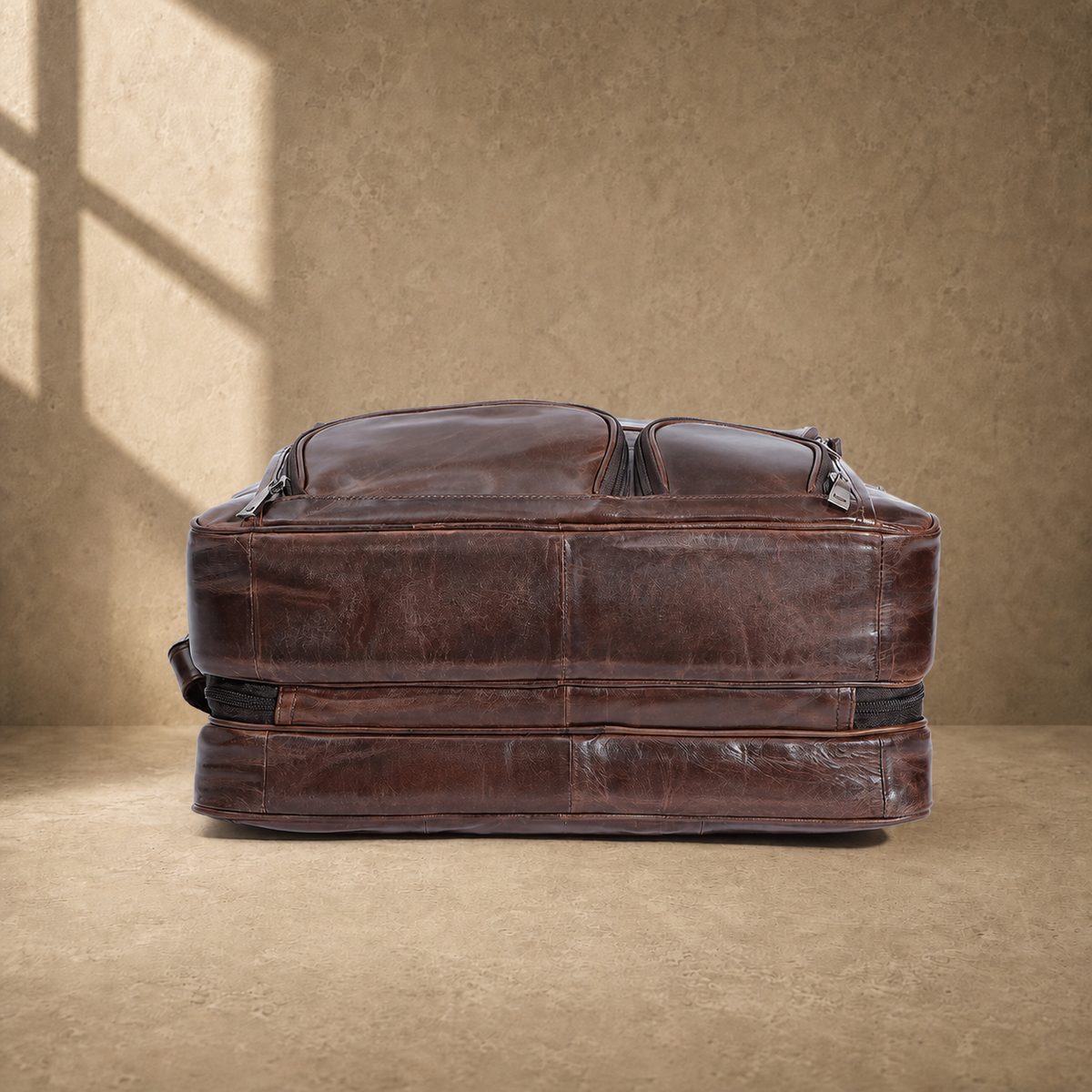 Brown cowhide multi-pocket briefcase reinforced base view