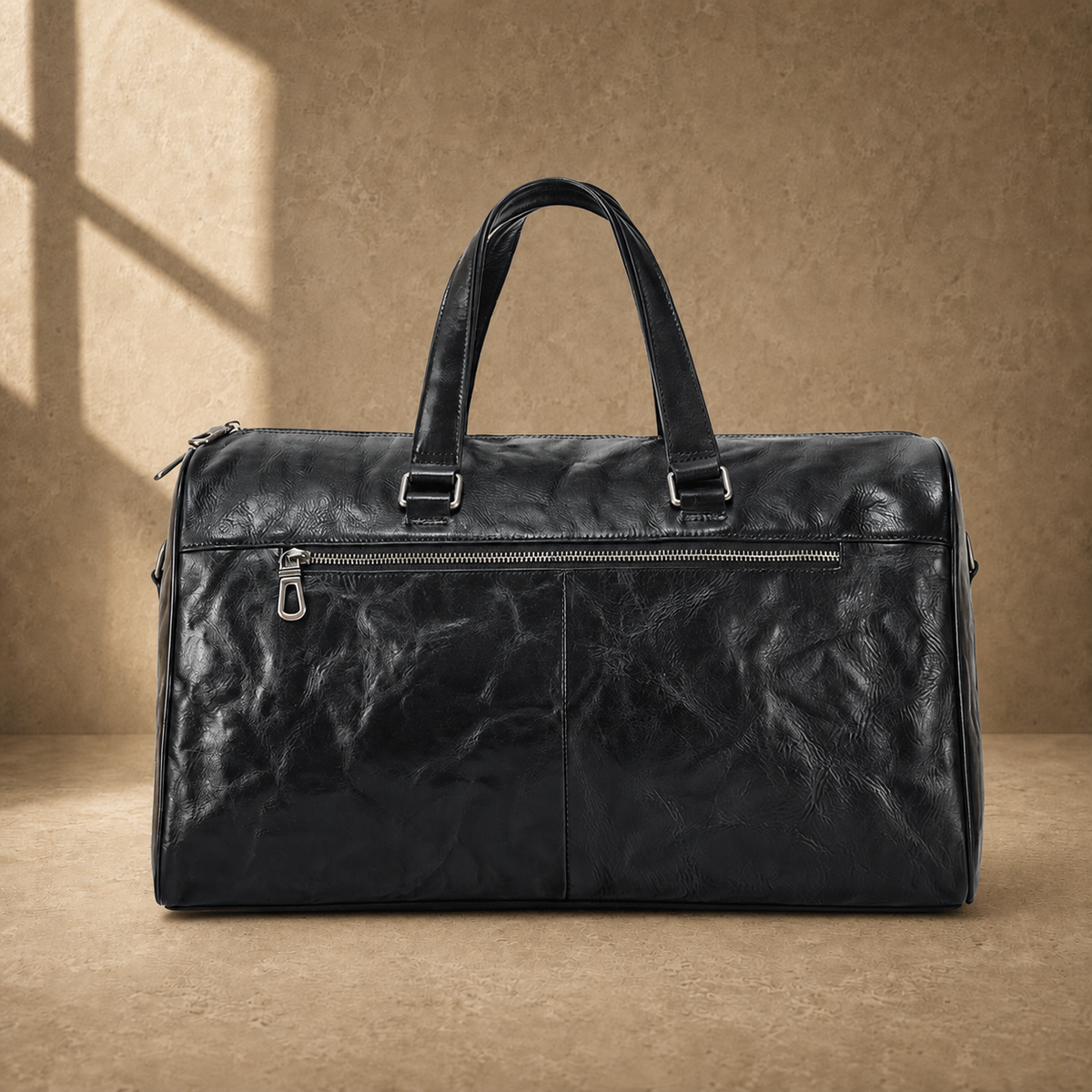 Black textured refined travel duffel with rear zipper pocket and luggage sleeve