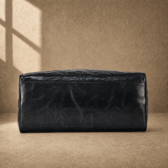 Black textured refined travel duffel, reinforced base view