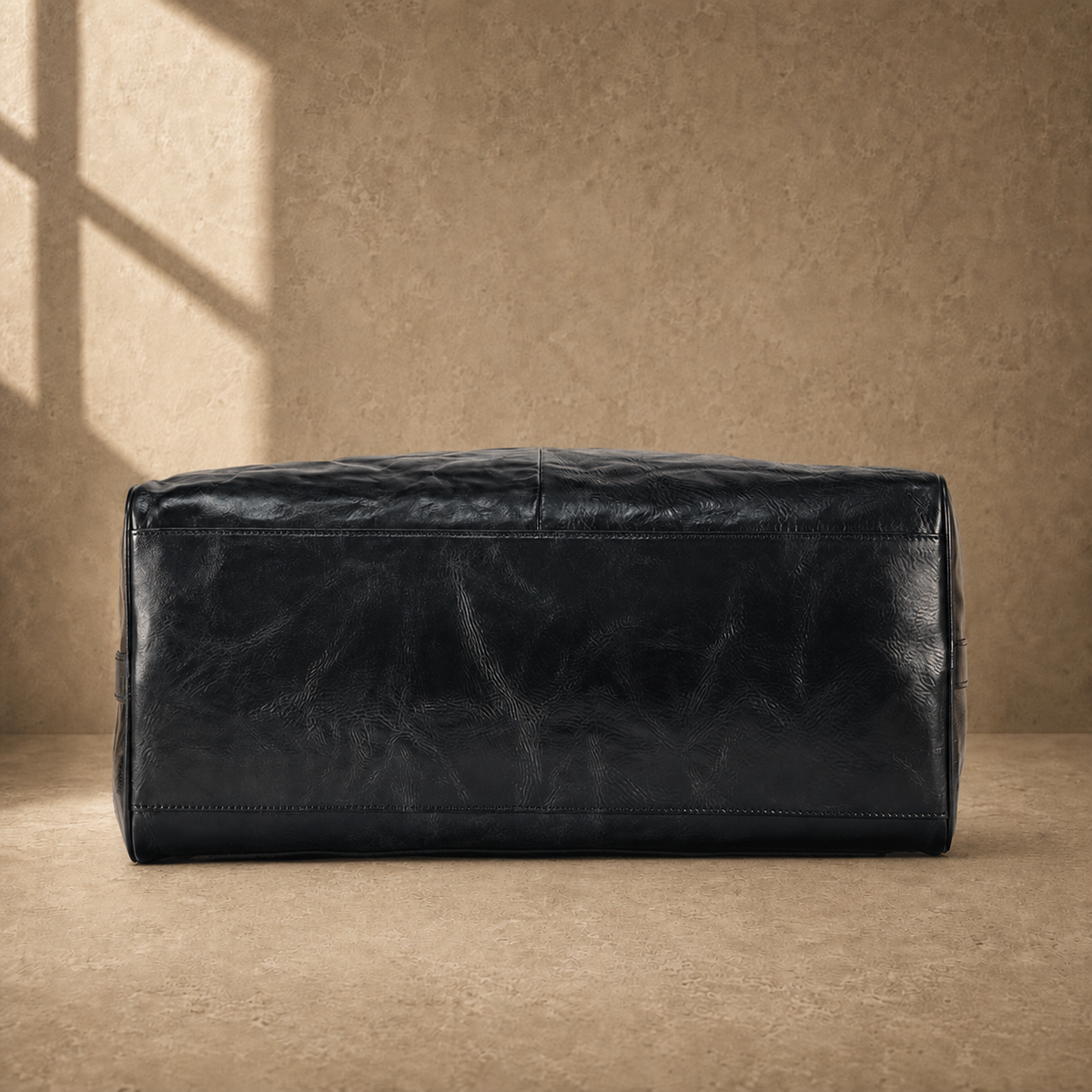 Black textured refined travel duffel, reinforced base view